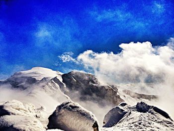 Scenic view of landscape against blue sky