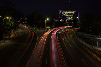 High angle view of light trails on road at night