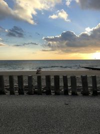 Scenic view of beach against sky during sunset