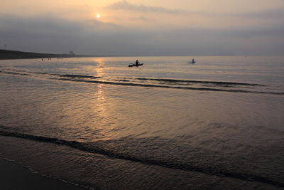 Scenic view of sea at sunset