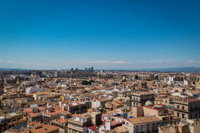 High angle view of townscape against blue sky