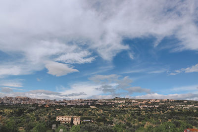 Aerial view of townscape against sky