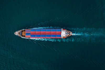 Aerial top view from drone, container ship or cargo shipping business service logistic 