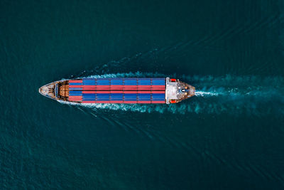 High angle view of ship sailing in sea