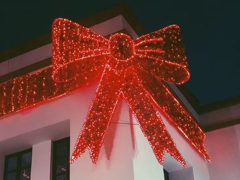 Low angle view of illuminated building at night