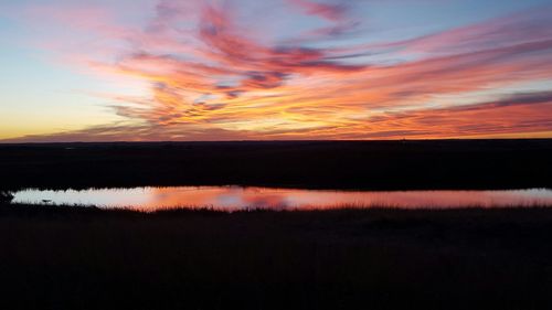 Scenic view of landscape at sunset