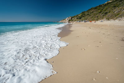 Scenic view of beach against clear sky