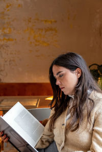 Portrait of young woman looking away