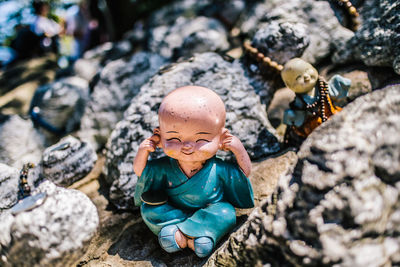 High angle view of toys on rock