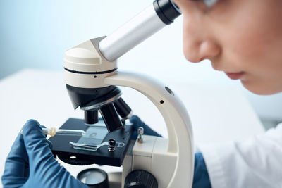 Close-up of man repairing machine part