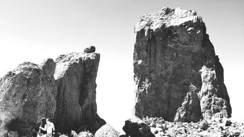 Low angle view of rock formation against clear sky