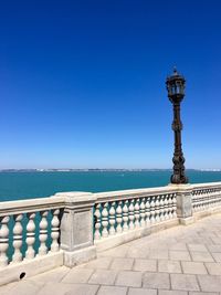 Scenic view of sea against clear blue sky