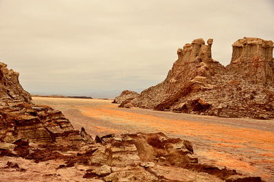 Rock formations on mountain against sky