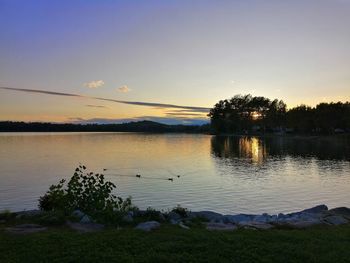 Scenic view of lake against sky during sunset