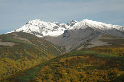 Scenic view of snowcapped mountains against sky