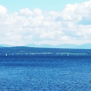 Scenic view of sea against cloudy sky