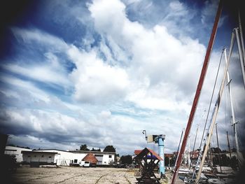 Scenic view of buildings in town against sky