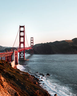 View of suspension bridge over sea