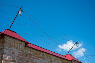 Low angle view of cables against sky