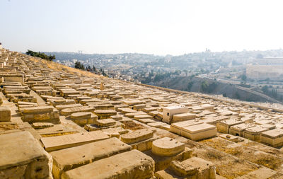 High angle view of buildings in city against clear sky