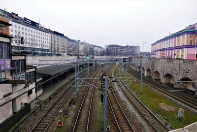 High angle view of railroad tracks in city against sky