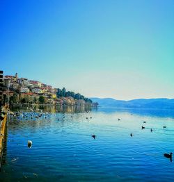 Scenic view of sea against clear blue sky