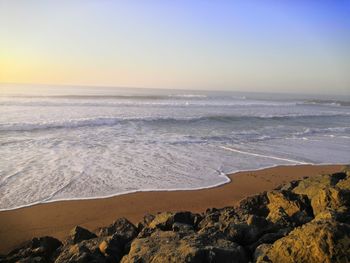 Scenic view of sea against clear sky