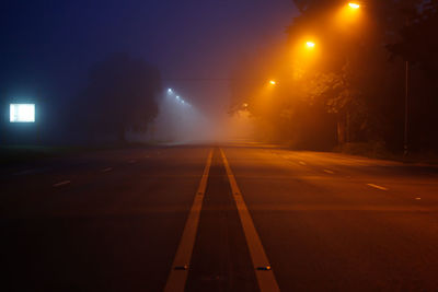 Illuminated road at night