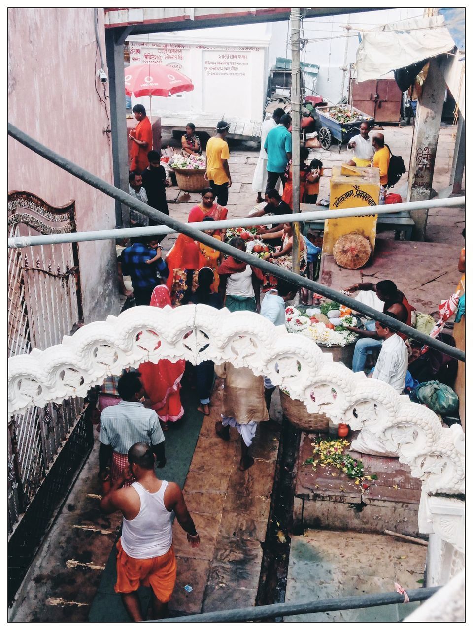 HIGH ANGLE VIEW OF PEOPLE WORKING AT MARKET