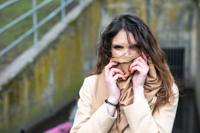 Portrait of woman standing outdoors