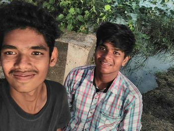 Portrait of happy mother and daughter outdoors