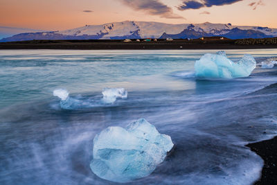 Iceberg on beach at jokulsarlon glacial lagoon