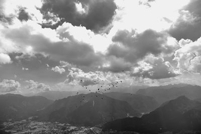 Scenic view of mountains against cloudy sky