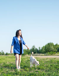 Full length of a dog on landscape