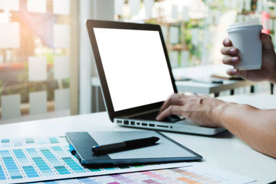 Man using laptop on table