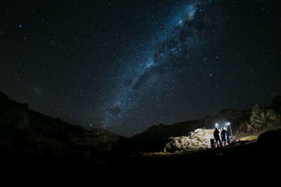 Low angle view of mountain range at night