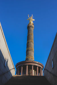 Low angle view of building against clear blue sky