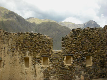 Built structure on mountain against sky