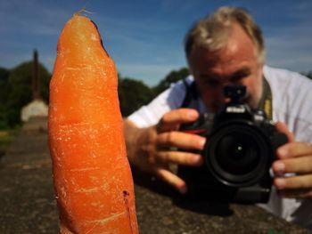 Close-up of hand holding mobile phone