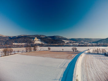 Scenic view of landscape against clear blue sky