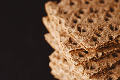 Close-up of cookies against black background