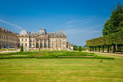 View of buildings against blue sky