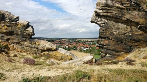 Rock formations on landscape against sky