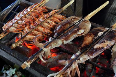 High angle view of prawns cooking on barbecue