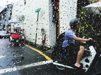 Water drops on car window during rainy season