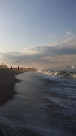 Scenic view of beach against sky during sunset