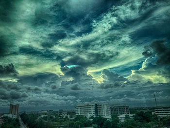 Storm clouds over buildings in city