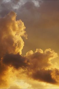 Low angle view of cloudy sky at sunset