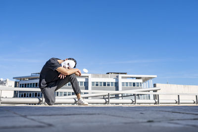 Side view of man against clear sky