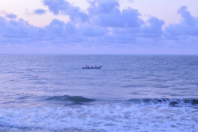   view of sea against sky boat on sea blueish sea